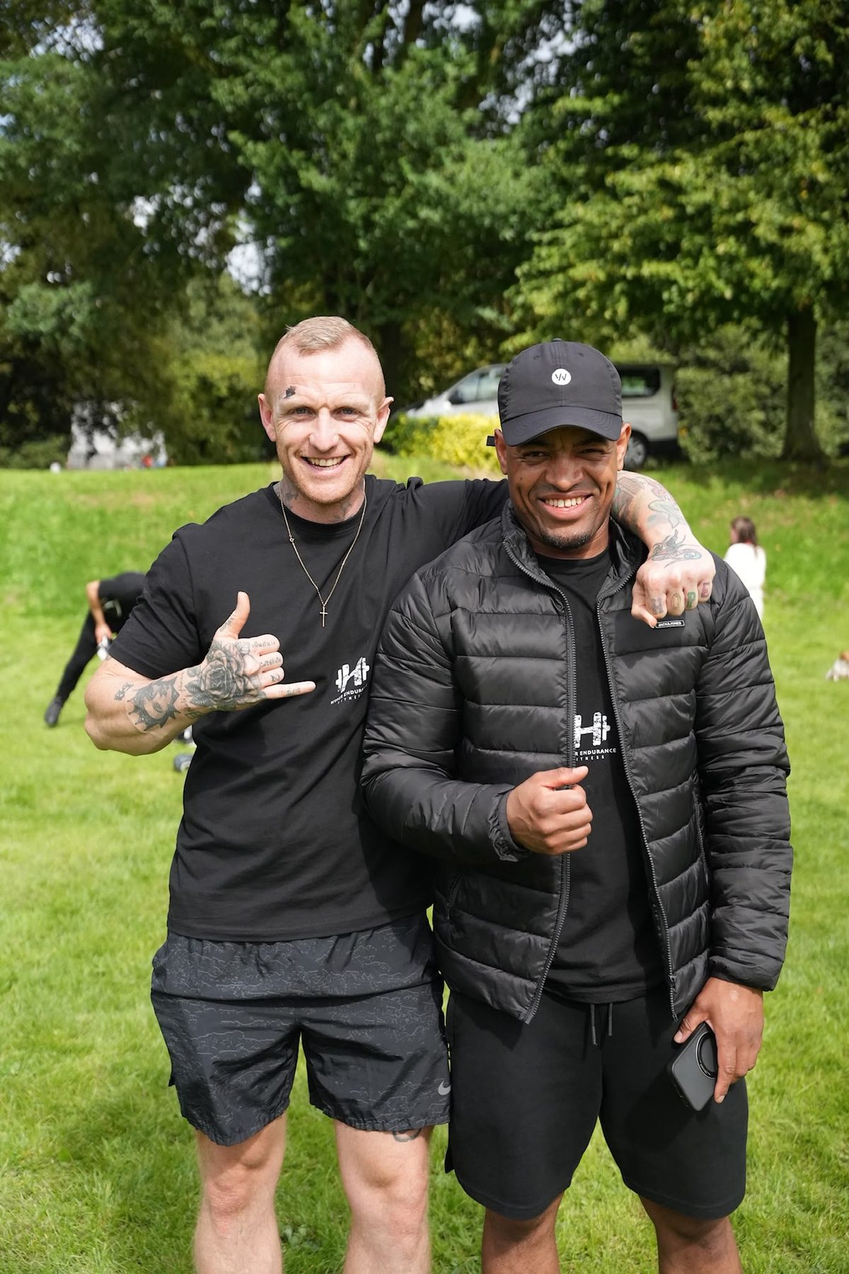 Derek Byrnes and Jay, founder of Hyper Endurance Fitness, smiling with an arm around each other in the park